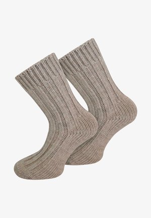 Stricksocken in hellbeige mit Rippstruktur, ausgestattet mit verstärkten Fersen und Zehen für erhöhte Langlebigkeit. Geeignet für den Alltag.
