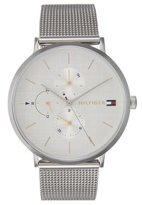 Montre argentée avec un cadran blanc texturé, trois sous-cadrans et des accents dorés. Équipée d'un bracelet en maille métallique et d'un design minimaliste.