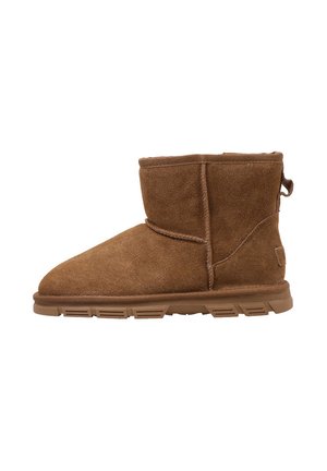 Brown suede ankle boot with soft texture, rounded toe, and a pull tab. Features a cushioned sole for comfort and flexible design.