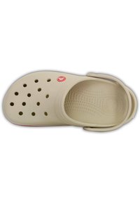 Beige clog with a rounded toe, multiple ventilation holes, and a pivoting backstrap. Textured insole and a logo accent near the front.