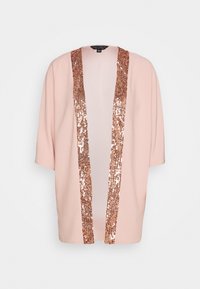 Vaaleanpunainen kimono-tyylinen takki, jossa on ruusukultaiset paljetit etuosan avausreunassa. Lyhyet hihat ja rento istuvuus.