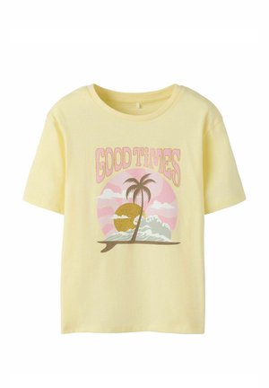 Children’s yellow t-shirt with "GOOD TIMES" text above a palm tree, waves, and sun graphic in pink, gold, and brown tones.