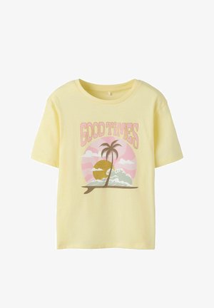 Children’s yellow t-shirt with "GOOD TIMES" text above a palm tree, waves, and sun graphic in pink, gold, and brown tones.