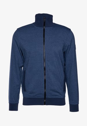 Marineblauwe ritsjack met hoge kraag, zwarte rits, rib gebreide mouwen en zijzakken. Gemaakt van een gestructureerde, rekbare stof.