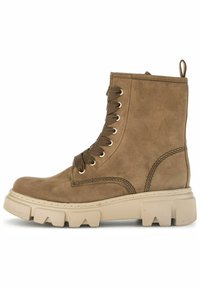 Pruunid nahast ankle-boots ümmarguse varbaga, nööridega disain, tugev beež tall ja külgmine tõmbeauk. Omab kuldseid silmuseid ja õmblusdetailideks.