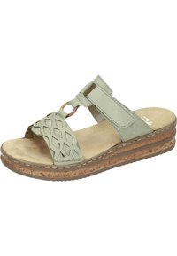 Green leather sandal with woven upper design, adjustable strap, textured insole, and cork-like wedge sole for added height and comfort.