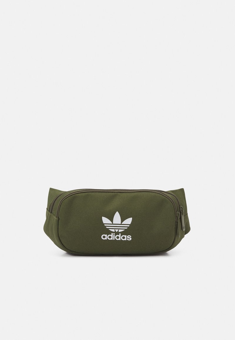 Olive green fabric fanny pack with a zip closure and white adidas logo. Rectangular shape, smooth texture, and adjustable strap.