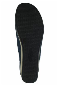 Suola di sneaker in gomma nera con un motivo di grip testurizzato, caratterizzata da una punta arrotondata e un sottile bordino bianco lungo il bordo.