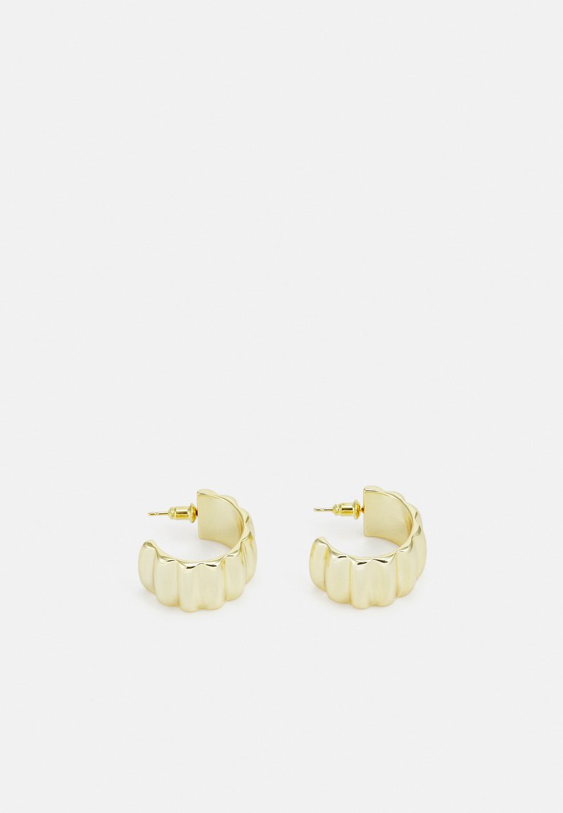 Gold metal hoop earrings with a wavy, scalloped design. Features a textured surface and a secure post closure for easy wear.