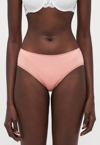 Light pink cotton briefs with lace trim along the waistband and leg openings. Soft texture, full coverage design, no additional embellishments.