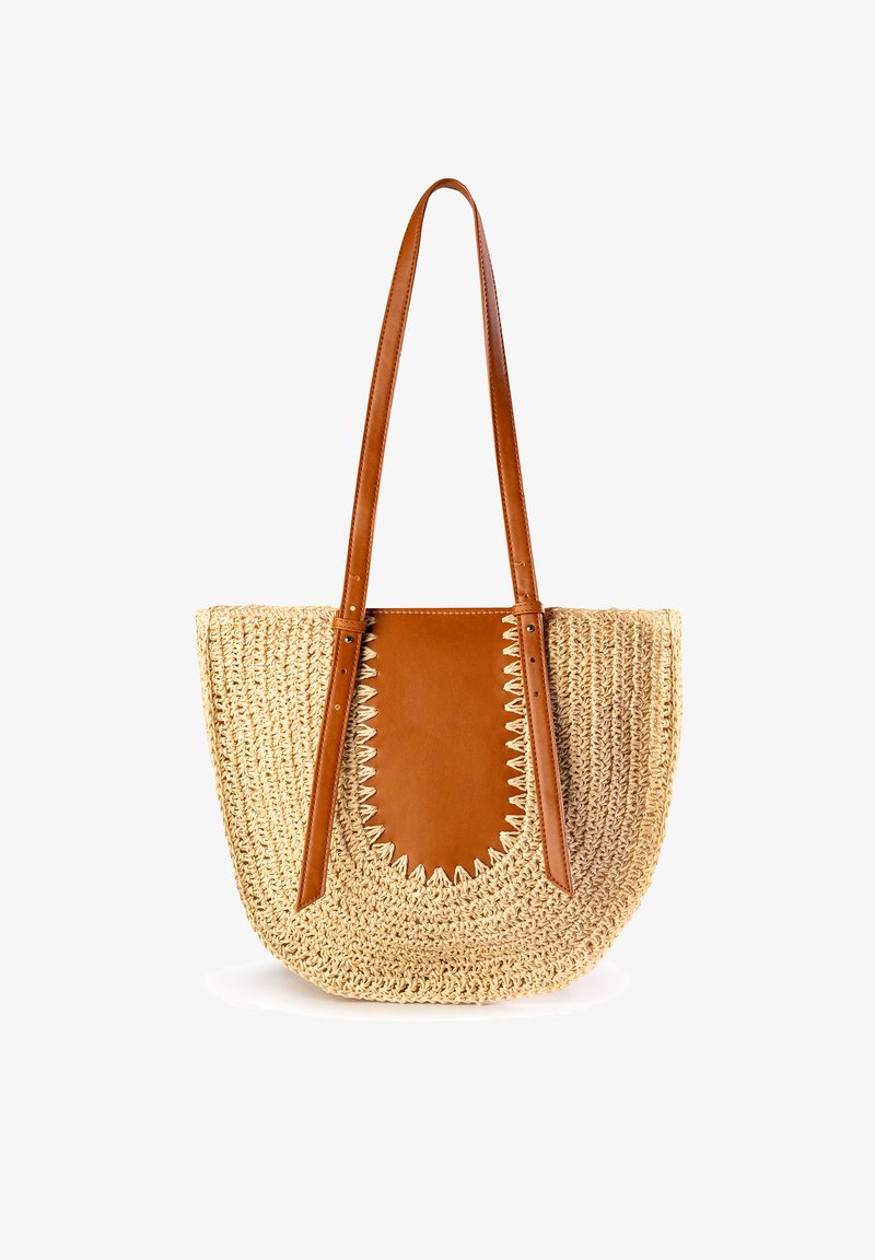 Torba z plecionej słomy z dużym brązowym skórzanym akcentem i dopasowanymi ramiączkami, z ząbkowanym wykończeniem na skórzanej wstawce.