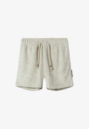 Svijetlosmeđi šorts od mekanog frotira. Ima elastičnu traku s vezicom i božni etiketu. Opušteni dizajn s udobnim krojem.