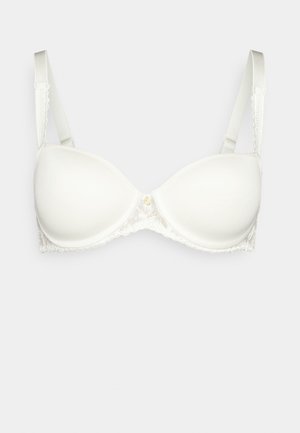 Hvit polstret bh med blondekant, glatt stoff, justerbare stropper og et sentralt feste med en liten dekorativ detalj.