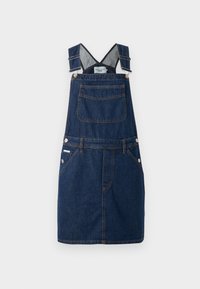 Robe salopette en denim bleu foncé, dotée de bretelles réglables, d'une poche frontale et de détails de boutons sur les côtés avec des accents de couture orange.