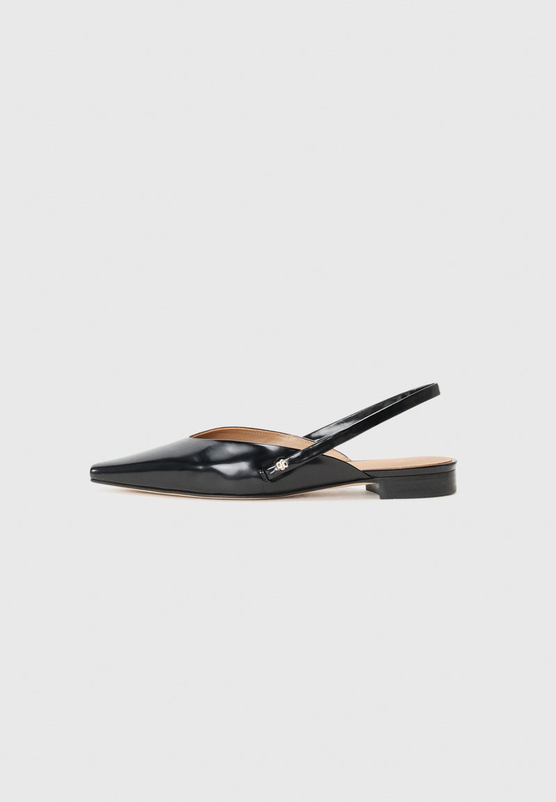 Black patent leather slingback shoes with a pointed toe and a low heel. Features a curved cut-out design with a tan interior.