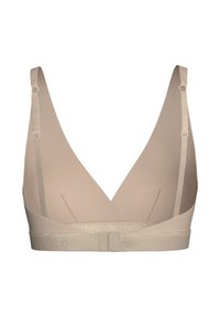 Beige wireless bra with a deep V-neck design, adjustable straps, and a textured gold band at the base. Smooth fabric with no embellishments.