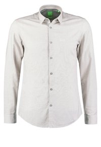 Light grey long-sleeve shirt made from textured fabric, featuring a button-up design, pointed collar, and small logo on the chest.