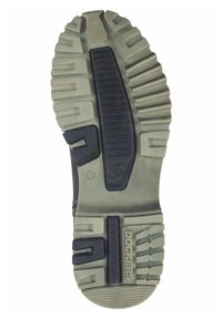Suela de zapato Dockers con banda de goma, que presenta una mezcla de ranuras verticales y horizontales, con una combinación de colores gris y negro, y detalle del logo.