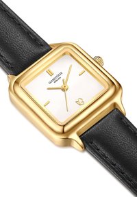Gold rectangular watch with a white face, black leather strap, and gold hardware. Features simple hour markers and a minimalist design.