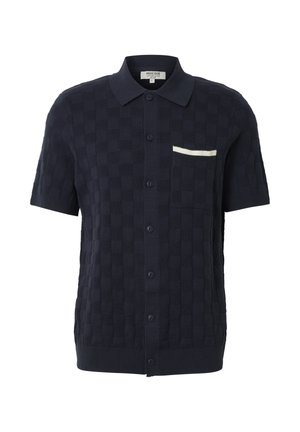 Marineblå kortermet skjorte med knappelukking, teksturert rutemønster, spiss krage, frontlomme med hvit kant og ribbet kant.