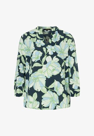 Navy blouse featuring large white and light blue floral patterns, V-neckline, 3/4 sleeves, and soft, smooth fabric texture.
