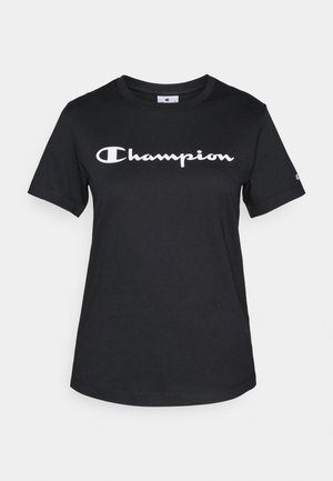 T-shirt en coton noir avec des manches courtes, un col rond, et un grand logo "Champion" blanc imprimé sur le devant.