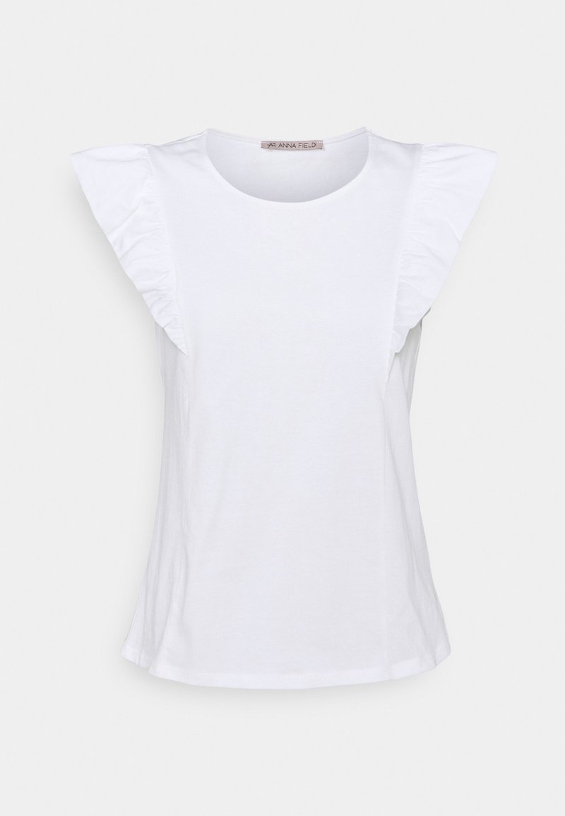 Blouse blanche sans manches avec détails froncés aux épaules et encolure ronde, présentée sur un fond neutre.