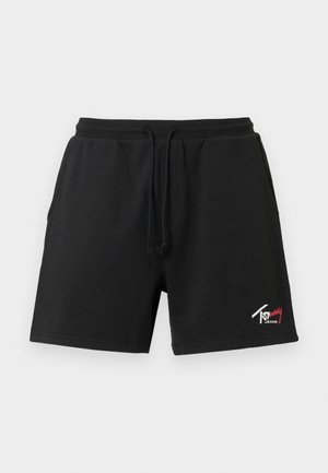 Czarne szorty z elastycznym pasem, sznurkiem do regulacji, bocznymi kieszeniami i małym białym i czerwonym logo Tommy Jeans na dolnej lewej nodze.