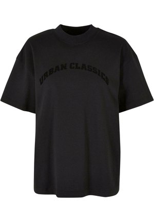 Čierne bavlnené tričko s uvoľneným strihom, krátkymi rukávmi a okrúhlym výstrihom, na prednej strane s potlačou "URBAN CLASSICS" v tučnom písme.