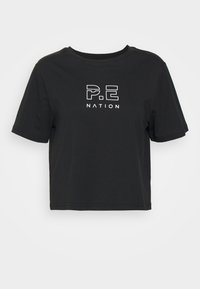 Black cropped t-shirt made of cotton, featuring a white logo print that reads "P.E NATION" in a modern font on the front. Short sleeves, crew neck.