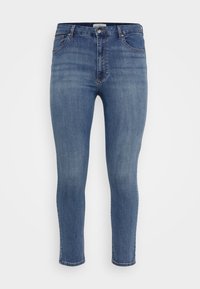 Modre jeans s slim fit krojem, petimi žepi, gumbom za zapiranje in rahlim bledenjem barve. Dolžina do gležnjev z urejenim robom.