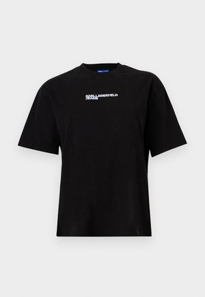 Musta puuvillapaita lyhyillä hihoilla, pyöreä pääntie ja valkoinen "KARL LAGERFELD JEANS" -logo rinnassa. Tasainen rakenne, rento istuvuus.
