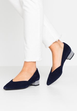 Navy suede low-heeled shoes with a pointed toe and a striped heel. The shoe design features a v-cut at the upper.