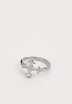 Silver ring featuring a fleur-de-lis design, polished finish, smooth texture, and a slight curve in the band.