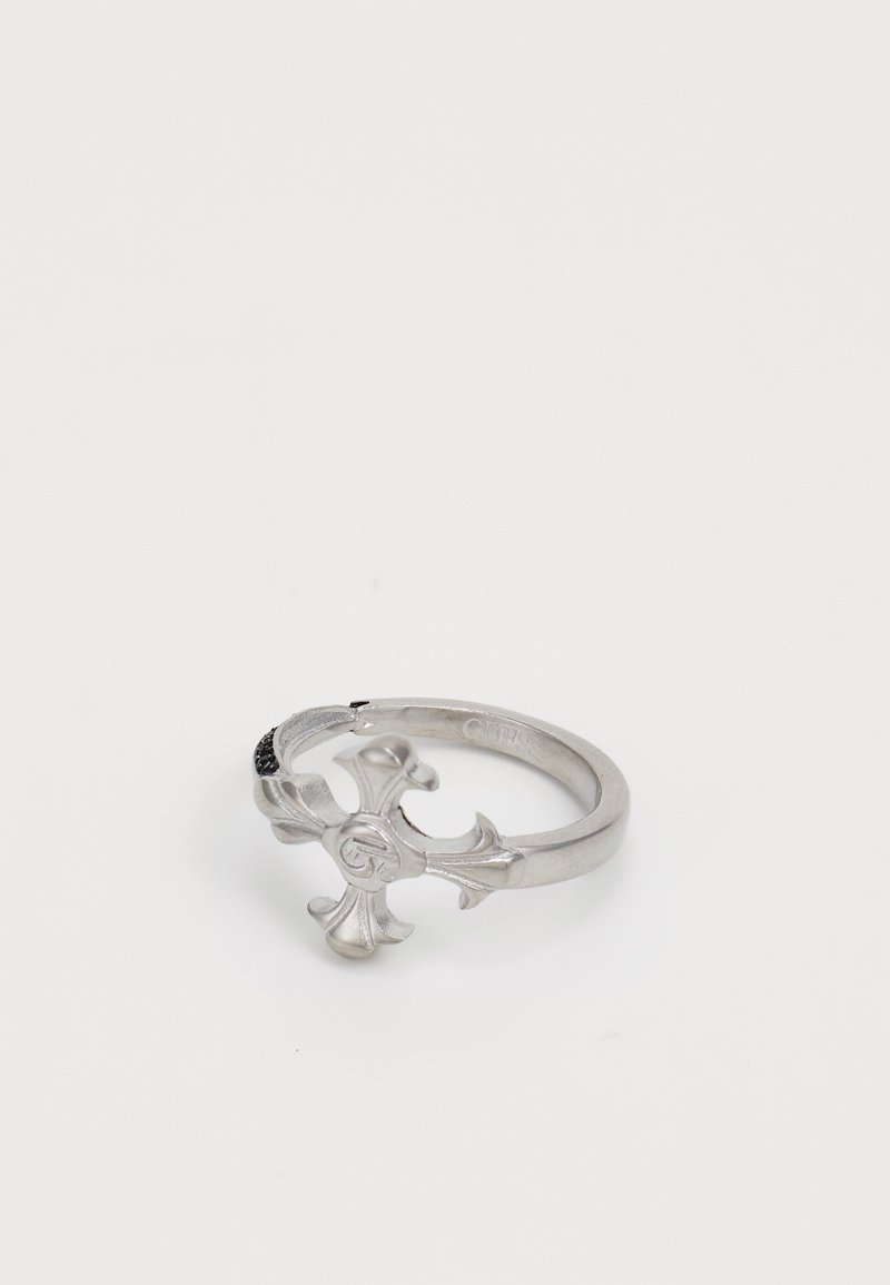 Silver ring featuring a fleur-de-lis design, polished finish, smooth texture, and a slight curve in the band.