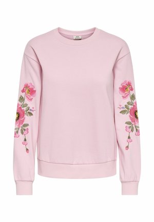 Roza majica z dolgimi rokavi, na obeh rokavih okrašena z vezenjem cvetličnih motivov v odtenkih roza in zelene. Mehka tkanina, sproščen kroj.