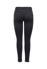 Black skinny jeans made of denim with a smooth texture, featuring two back pockets and a high-rise waist.