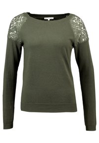 Olivgrüner Pullover mit langen Ärmeln und Spitze an den Schultern. Glatte Textur mit gerippten Rippbündchen und Saum. Lockerer Schnitt.