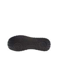 Sole di scarpa in gomma nera con un motivo di battistrada testurizzato, caratterizzato da scanalature ondulate e accenti circolari per aderenza e trazione.
