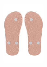 Růžové vložky vyrobené z texturované gumy s květinovým vzorem a třemi kulatými bílými akcenty, navržené pro pohodlí a podporu.