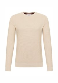 Béžový svetr s dlouhým rukávem a kulatým výstřihem, žebrovanou texturou a jemným logem na prsou. Měkká látka a přiléhavý střih.