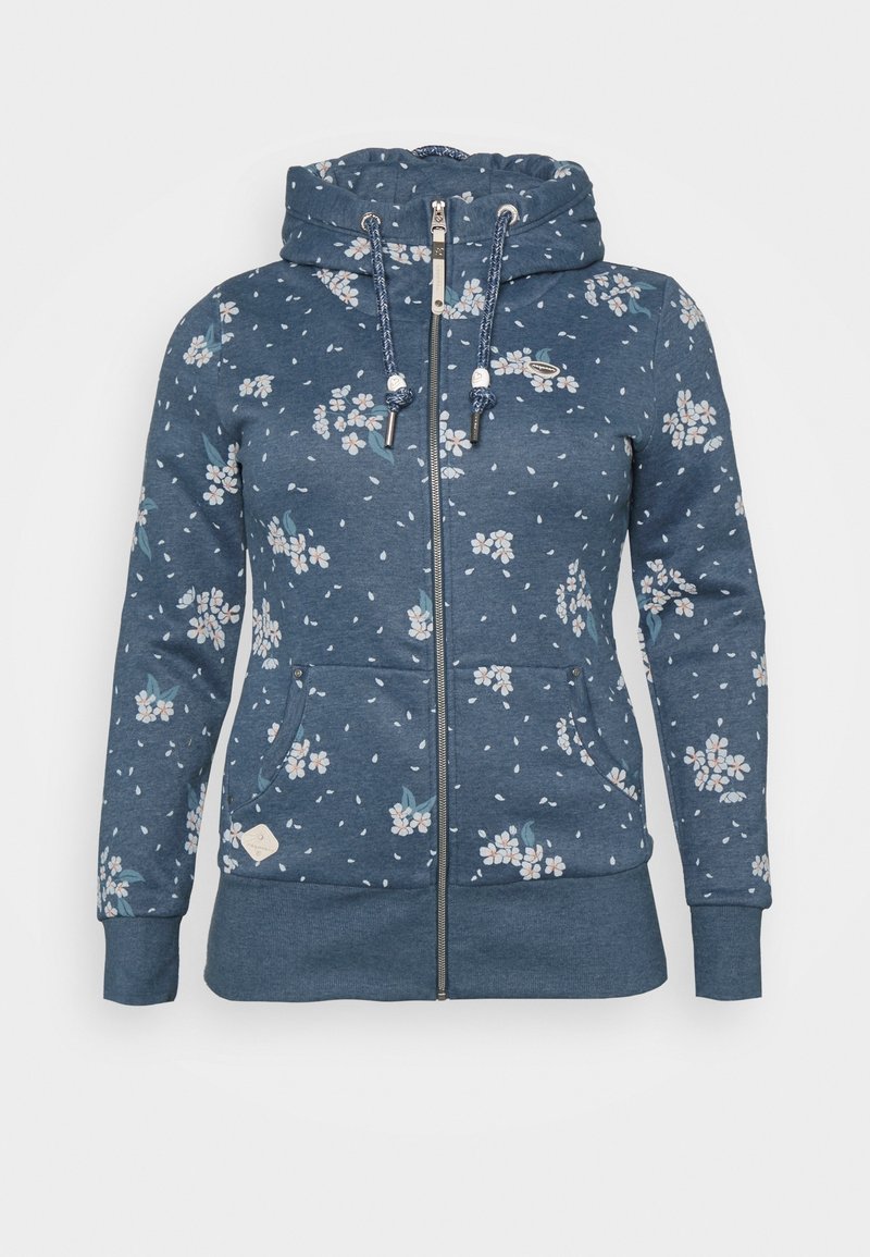 Sweat à capuche zippé bleu avec motif floral blanc et rose pâle, capuche à cordon, poches frontales, et poignets et ourlet côtelés.