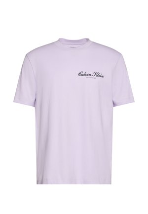 Lavender short-sleeve t-shirt with black "Calvin Klein Established 1968" text on left chest, crew neckline, plain design.
