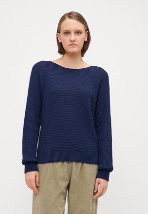 Navy knitted sweater with a wide, boat neckline, long sleeves, and ribbed hem. The texture features a subtle horizontal pattern.