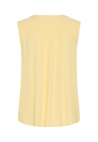 Blouse sans manches jaune pastel avec col rond et coupe ample, vue de dos avec une texture verticale subtile.