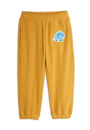 Mustard yellow fleece pants with elastic waist and cuffs, featuring a blue cartoon mammoth patch on the upper left leg.
