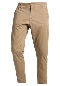 Beżowe, dopasowane, codzienne spodnie z szlufkami na pasek, przednim guzikiem, zamkiem błyskawicznym i bocznymi kieszeniami.