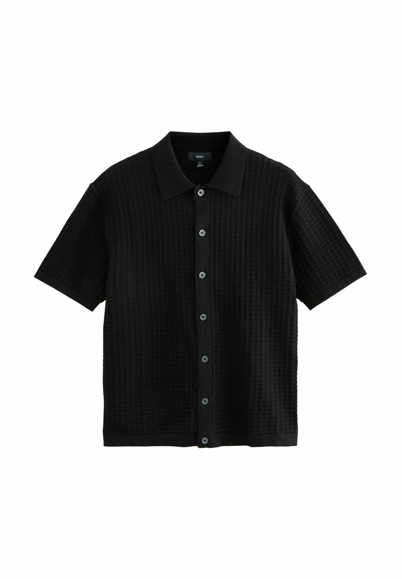 Black short-sleeve shirt with a textured pattern, button-up front, and a pointed collar. Features contrasting buttons and a straight hem.
