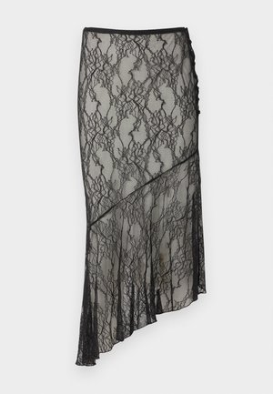 Jupe midi asymétrique en dentelle noire avec motif floral et ourlet festonné sur fond clair.