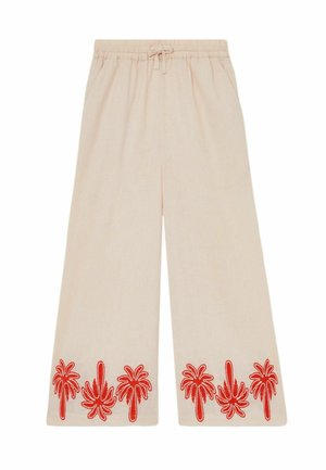 Pantalones beige de pierna ancha con cintura elástica y patrones bordados en rojo de palmeras a lo largo del dobladillo inferior en ambas piernas.